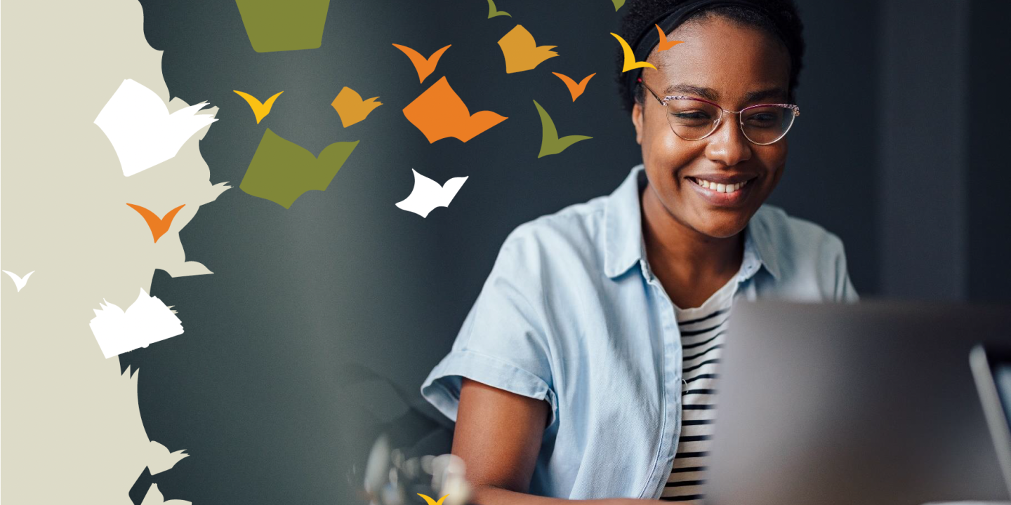 Lady sitting at laptop and smiling